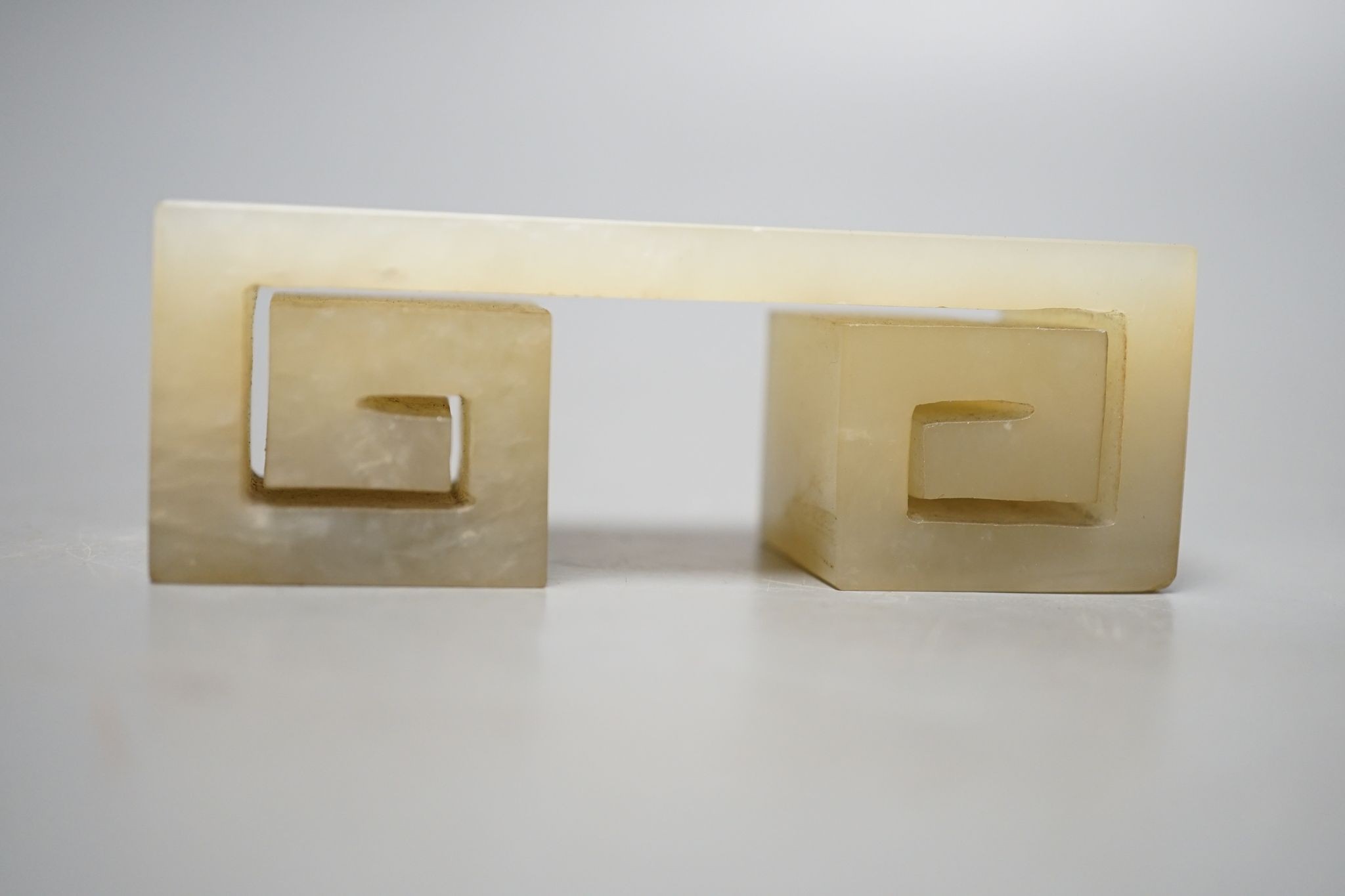 A Chinese pale celadon jade brush rest, 9.5 cms high.